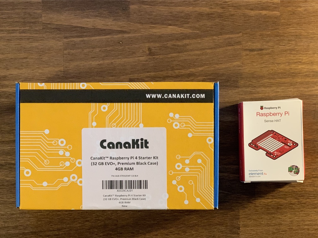 Raspberry Pi kit and Sense HAT in their boxes